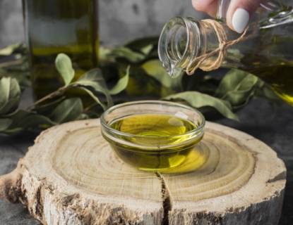 close-up-olive-oil-pouring-into-bowl